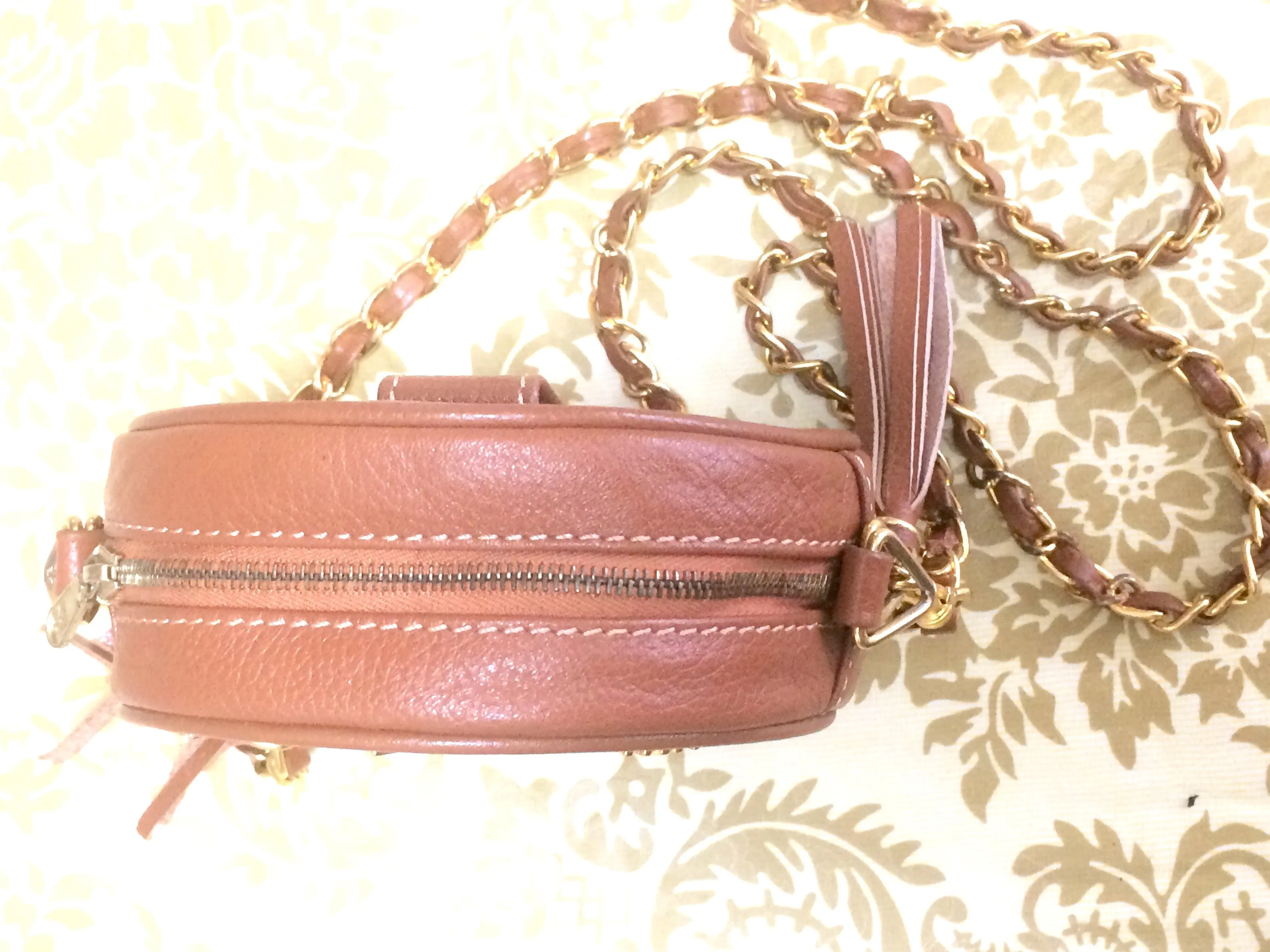 Vintage MCM brown leather round mini Suzy Wong shoulder bag with golden logo motifs. trimmings. Designed by Michael Cromer.