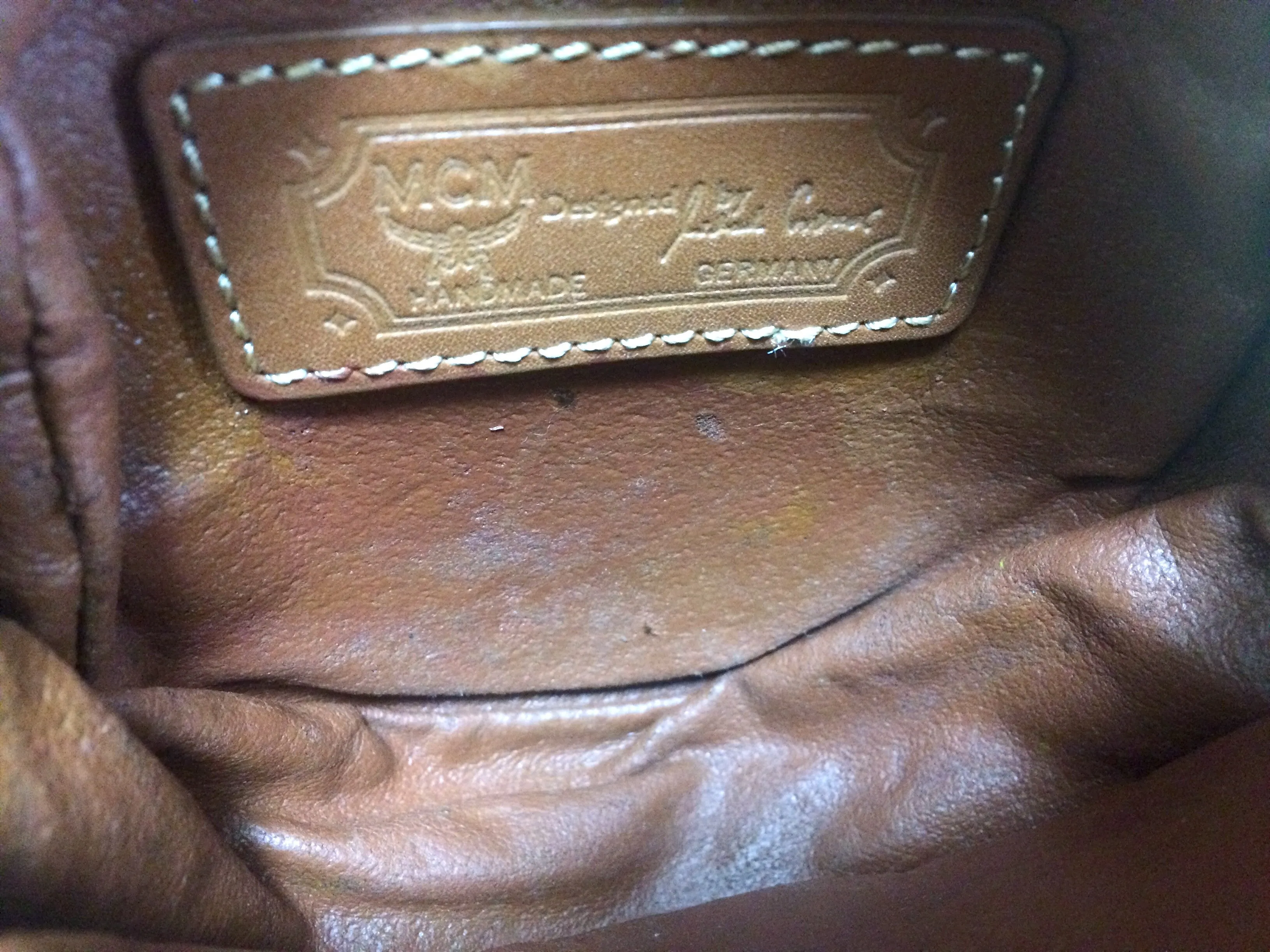 Vintage MCM brown leather round mini Suzy Wong shoulder bag with golden logo motifs. trimmings. Designed by Michael Cromer.