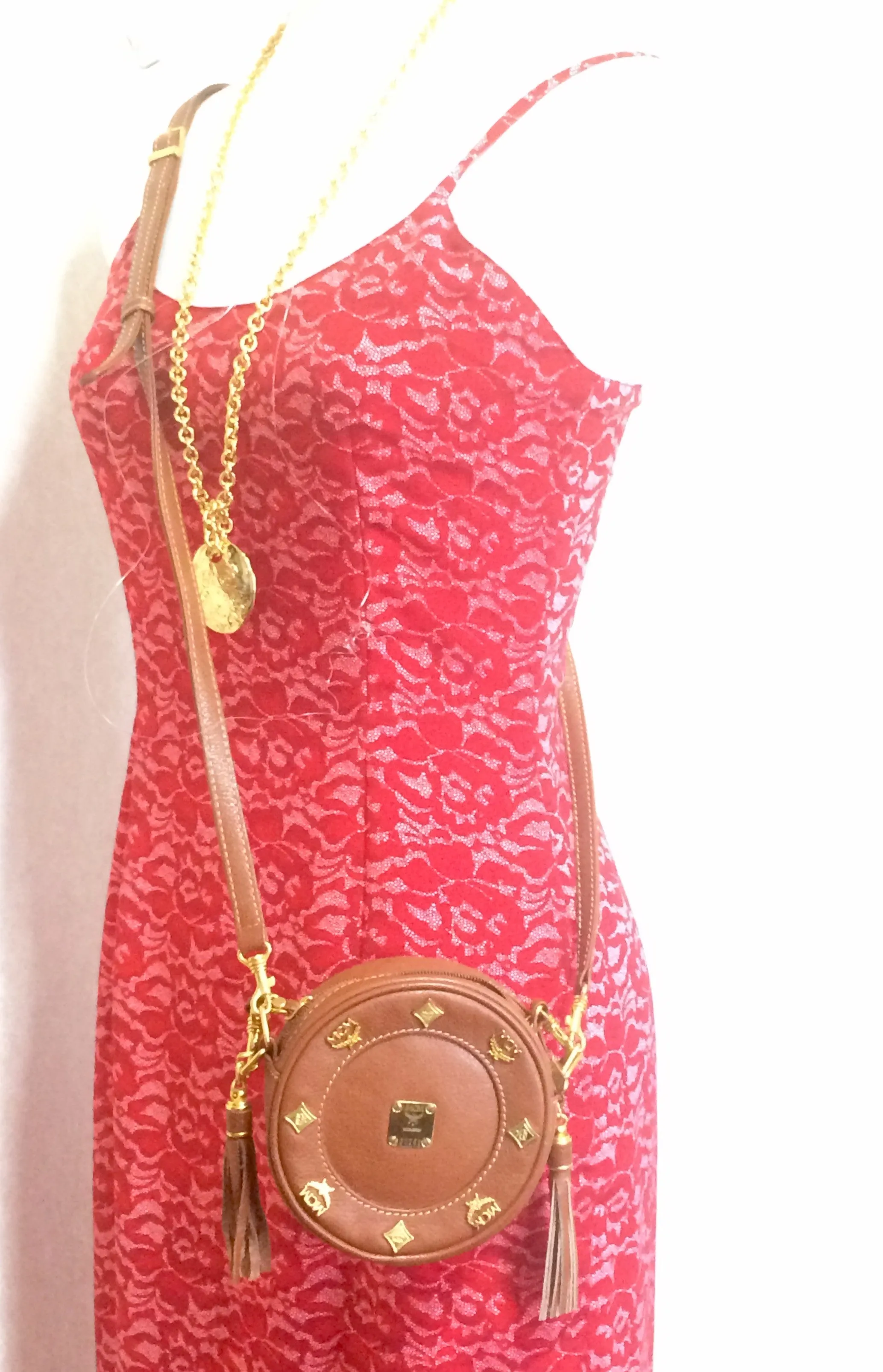 Vintage MCM brown leather round mini Suzy Wong shoulder bag with golden logo motifs. trimmings. Designed by Michael Cromer.